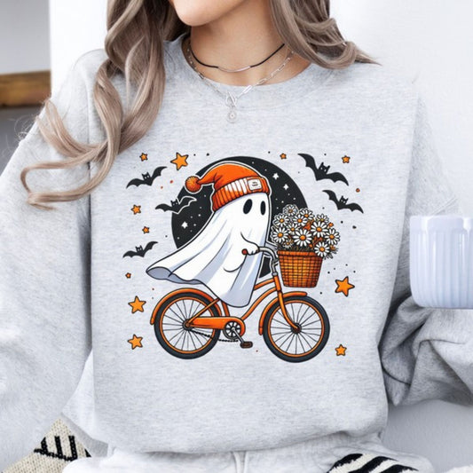 Person wearing a gray sweatshirt with a ghost riding a bike and holding flowers graphic.