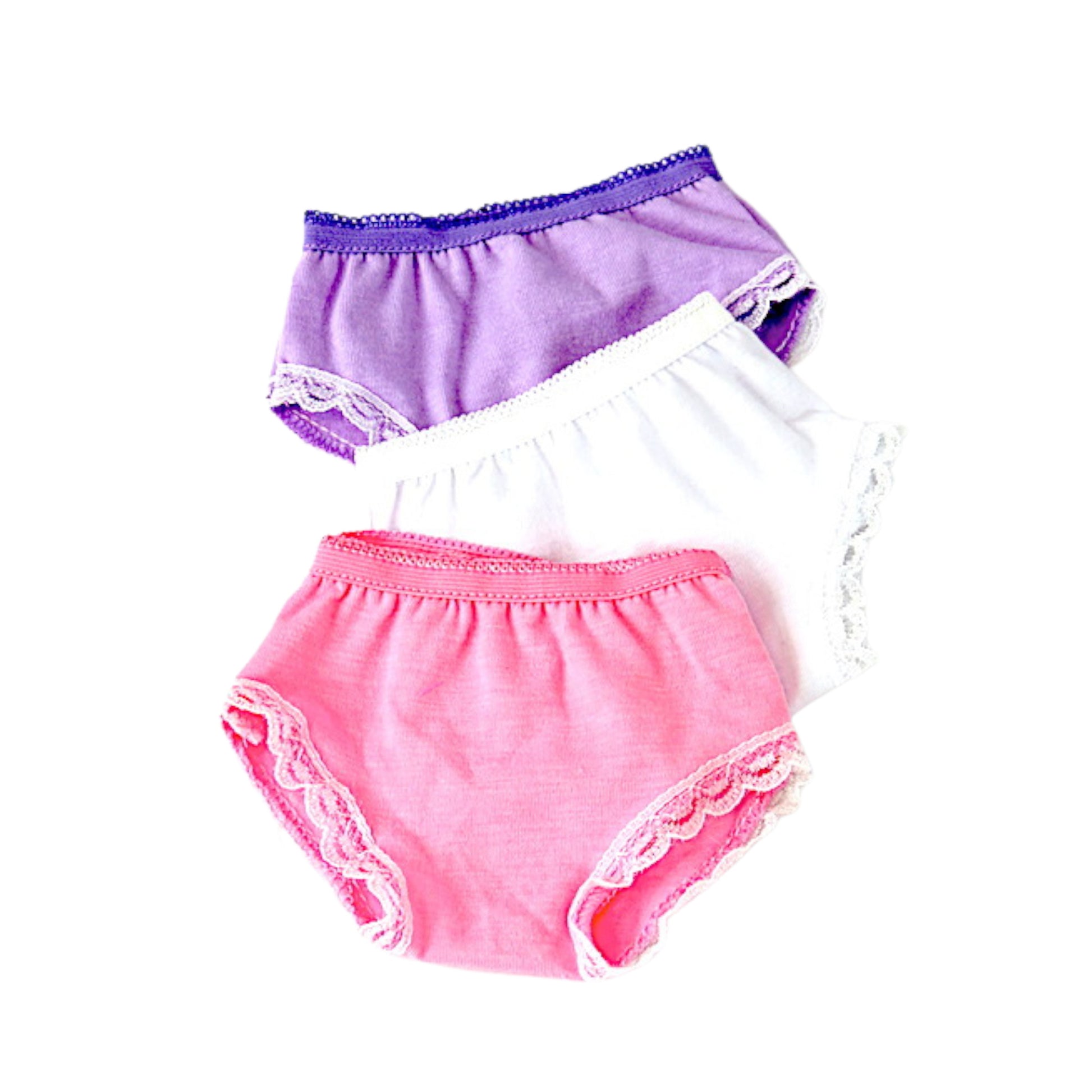 Three pairs of colorful underwear with lace trim on a white background