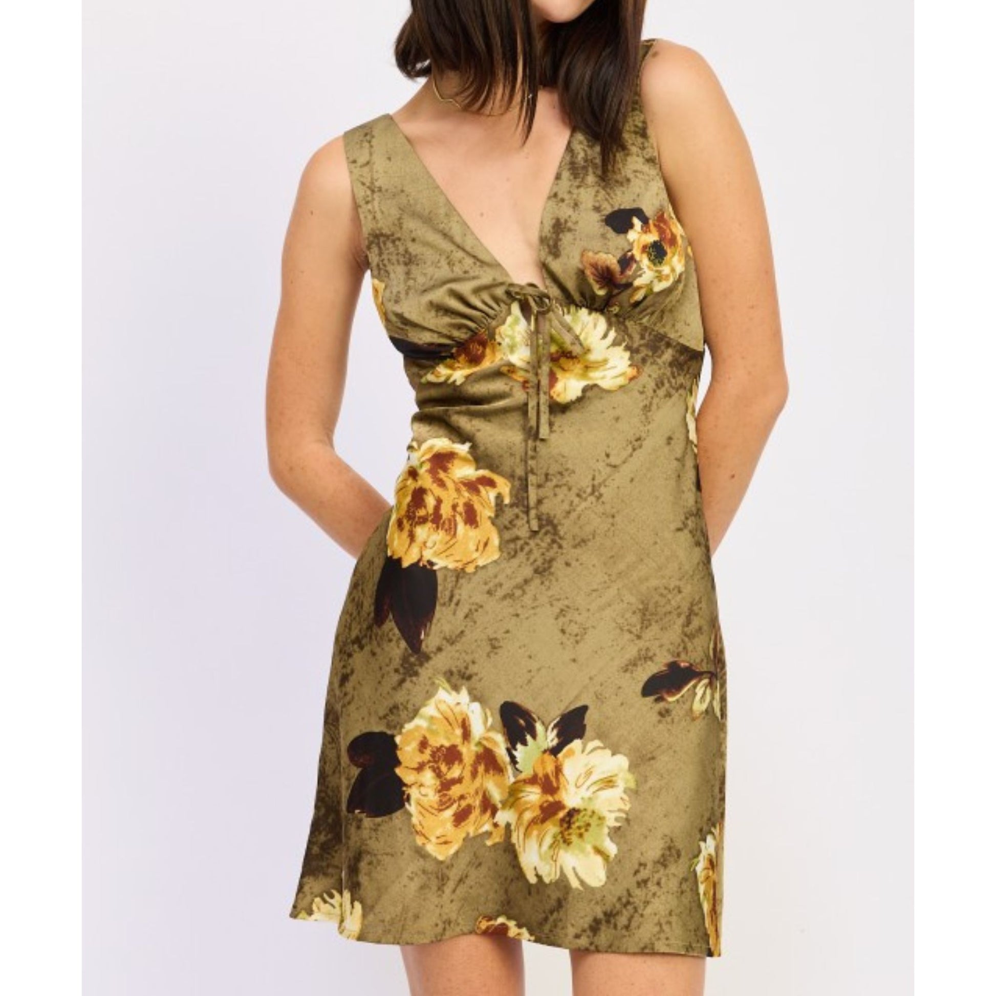 Woman wearing a floral dress on a white background