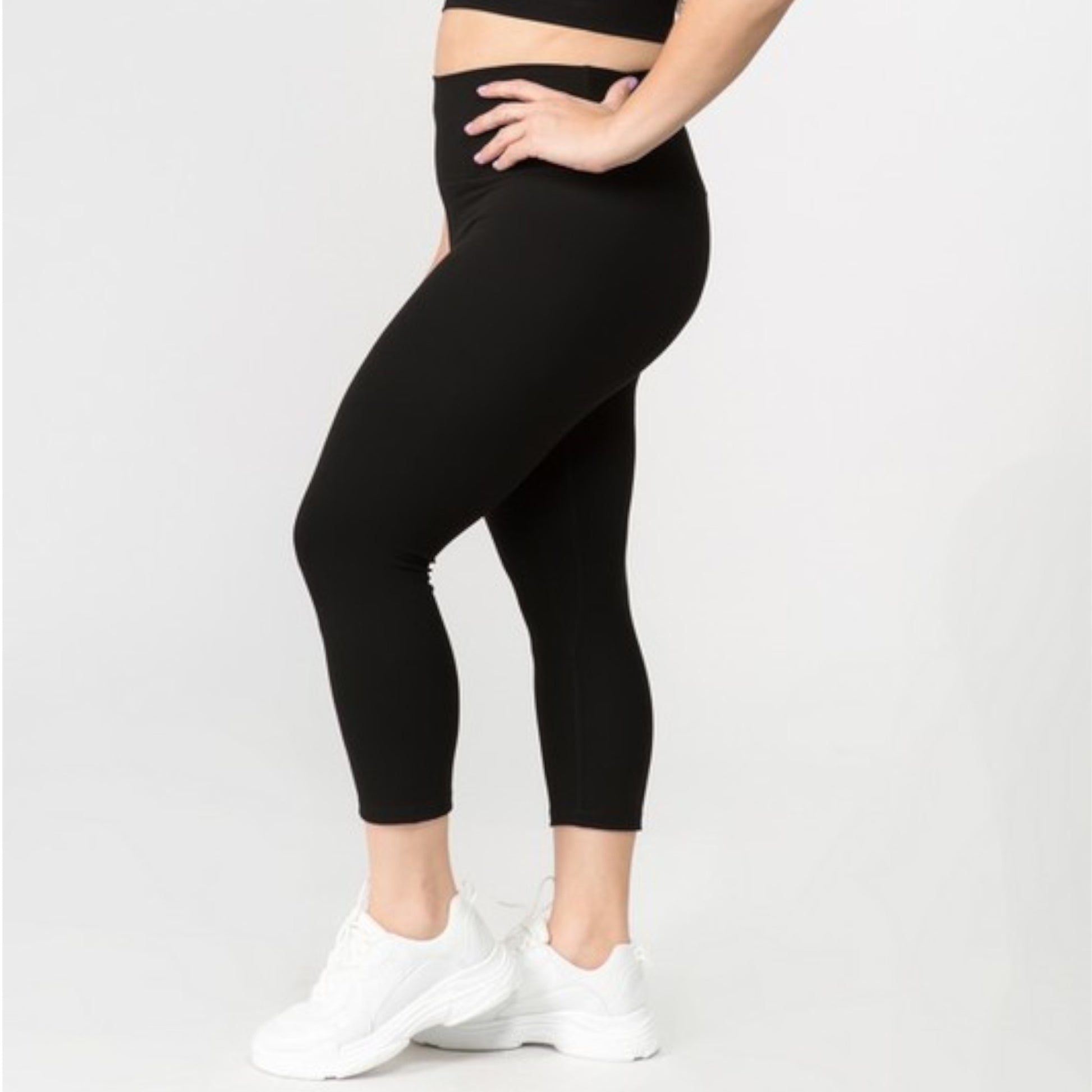 Black Buttery Soft Capri Activewear  Leggings Plus on Model Side view Left knee bent