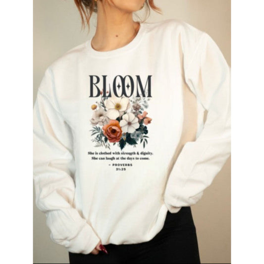 White sweatshirt with floral design and text on a neutral background