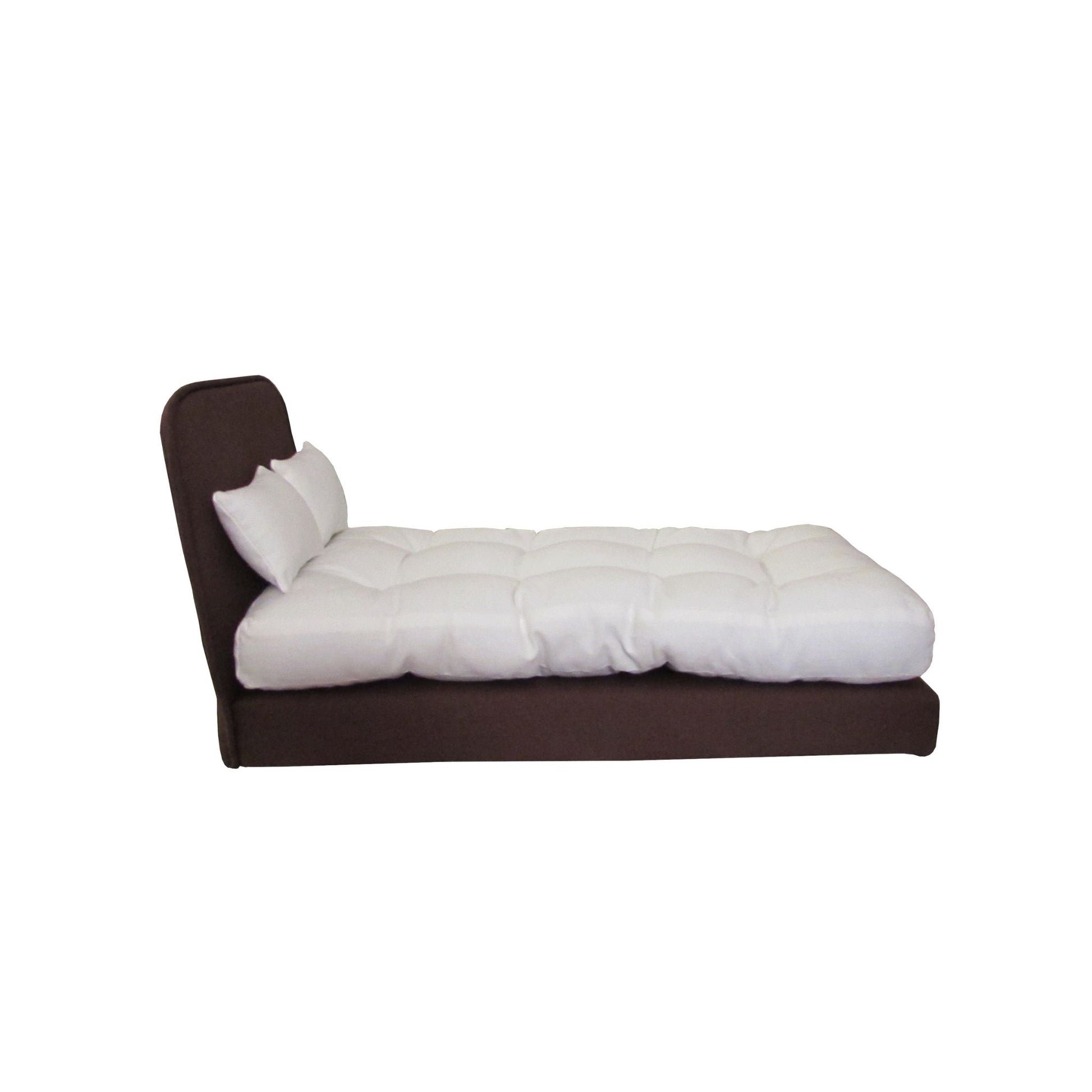 White doll mattress and two pillows on a brown doll bed - Side view