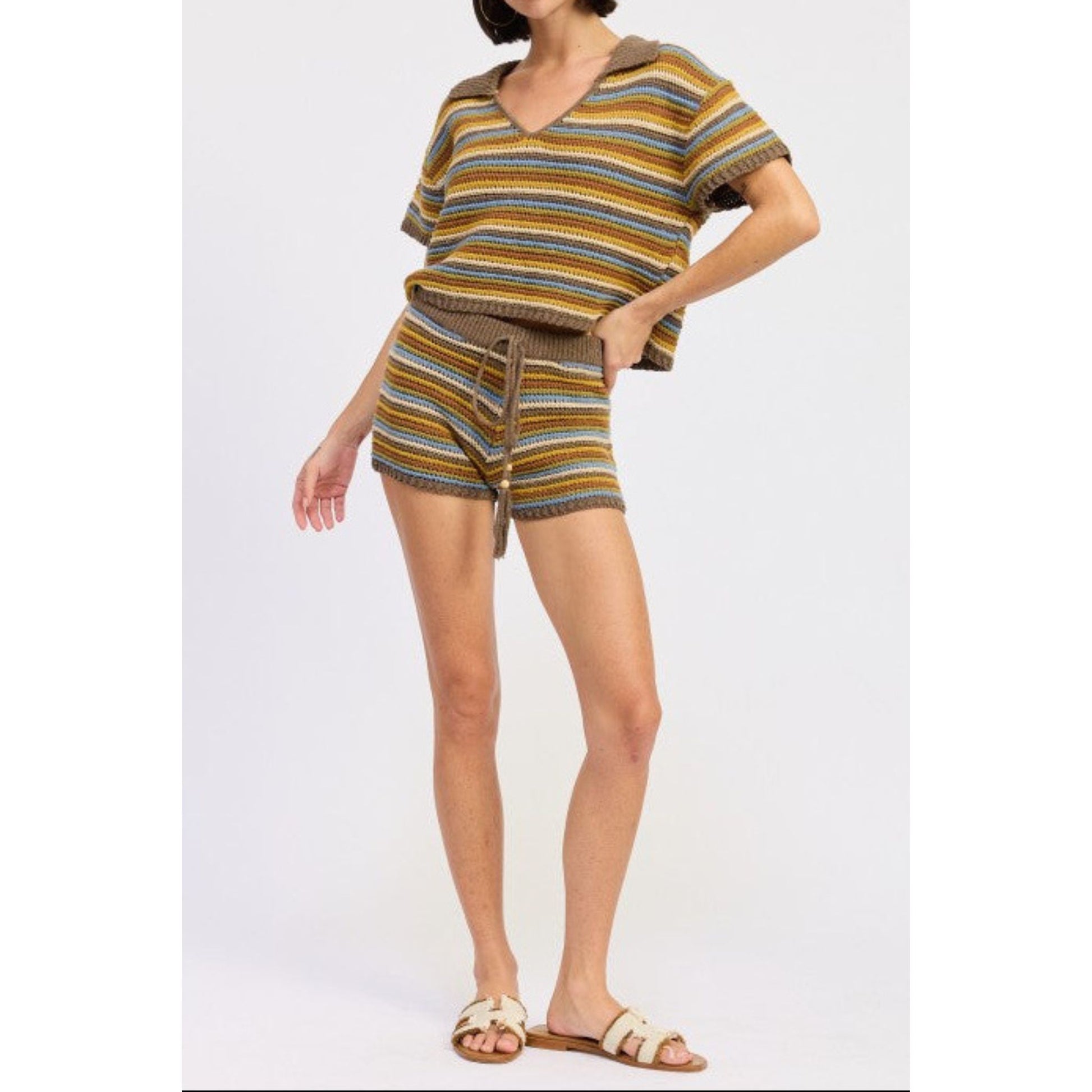 Woman wearing a striped outfit on a white background