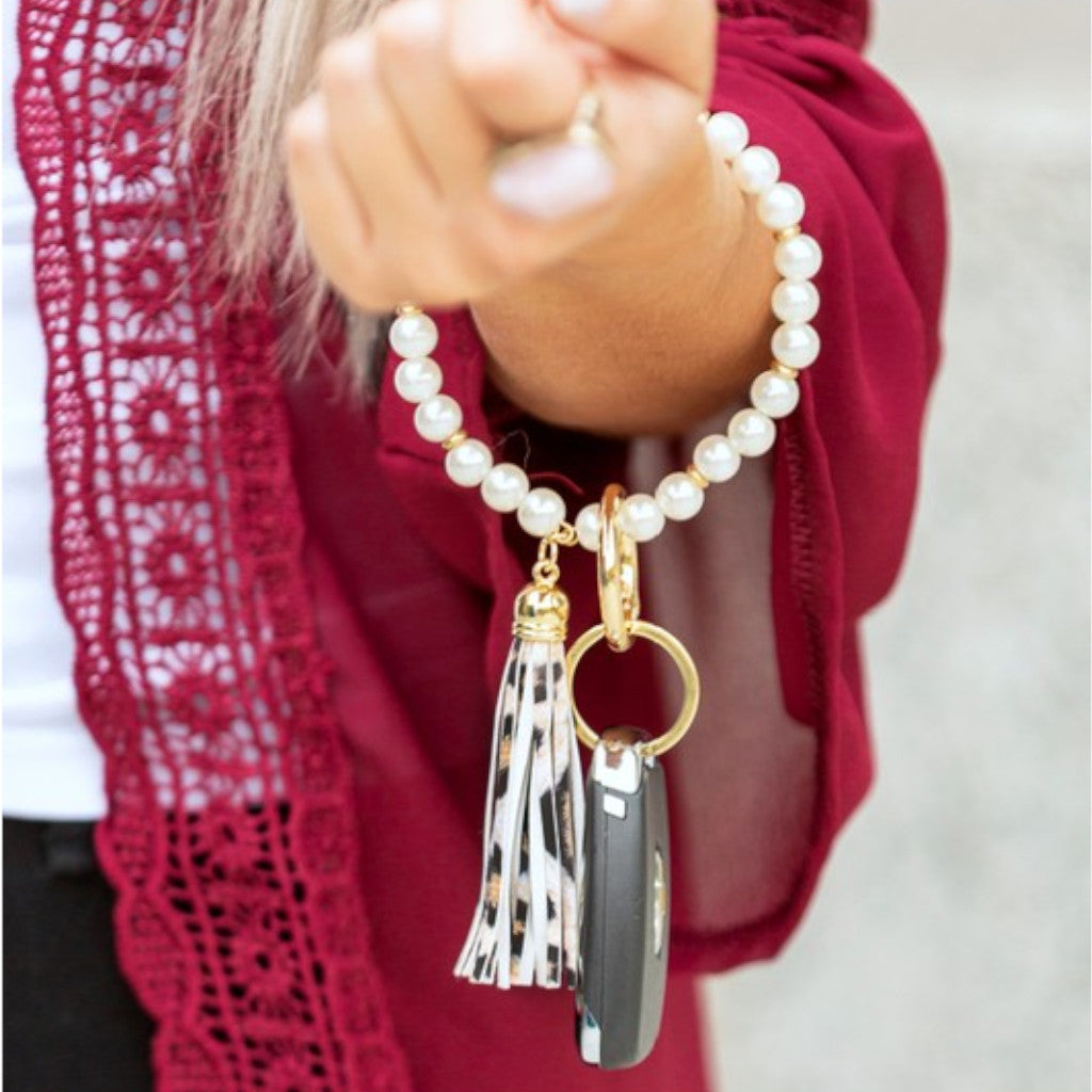 Classic Pearl Leopard Key Ring Bracelet with Woman in Red Top