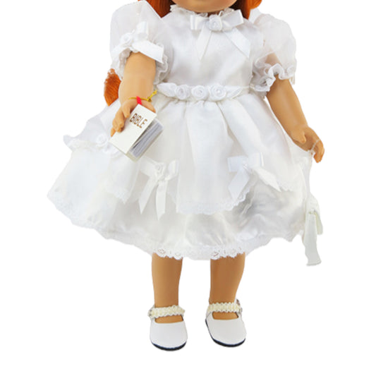 Doll wearing a white dress with ruffles on a white background