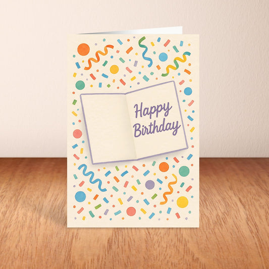 Birthday card with colorful confetti design and 'Happy Birthday' text on a wooden surface.