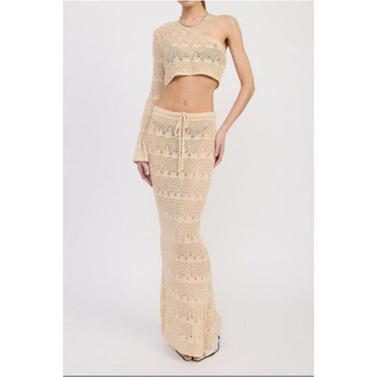 Cream crochet top and skirt set on a white background