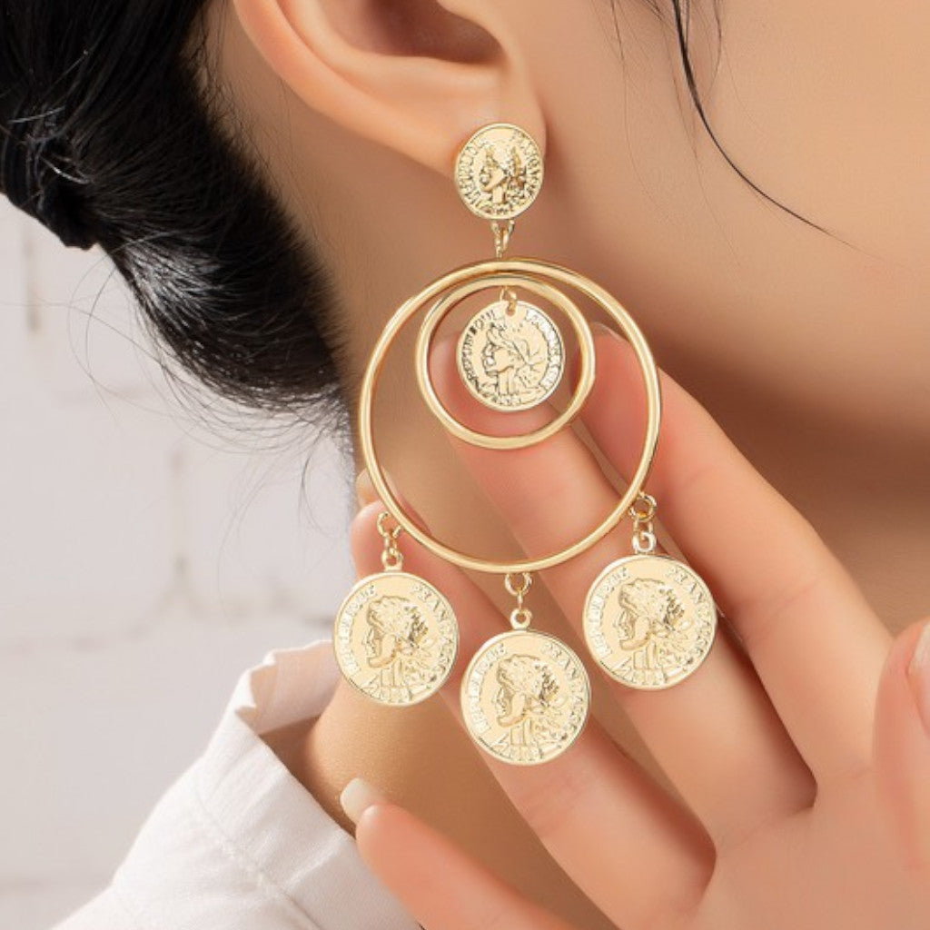 Double Hoop Drop Earrings with Dangling Coins on ear