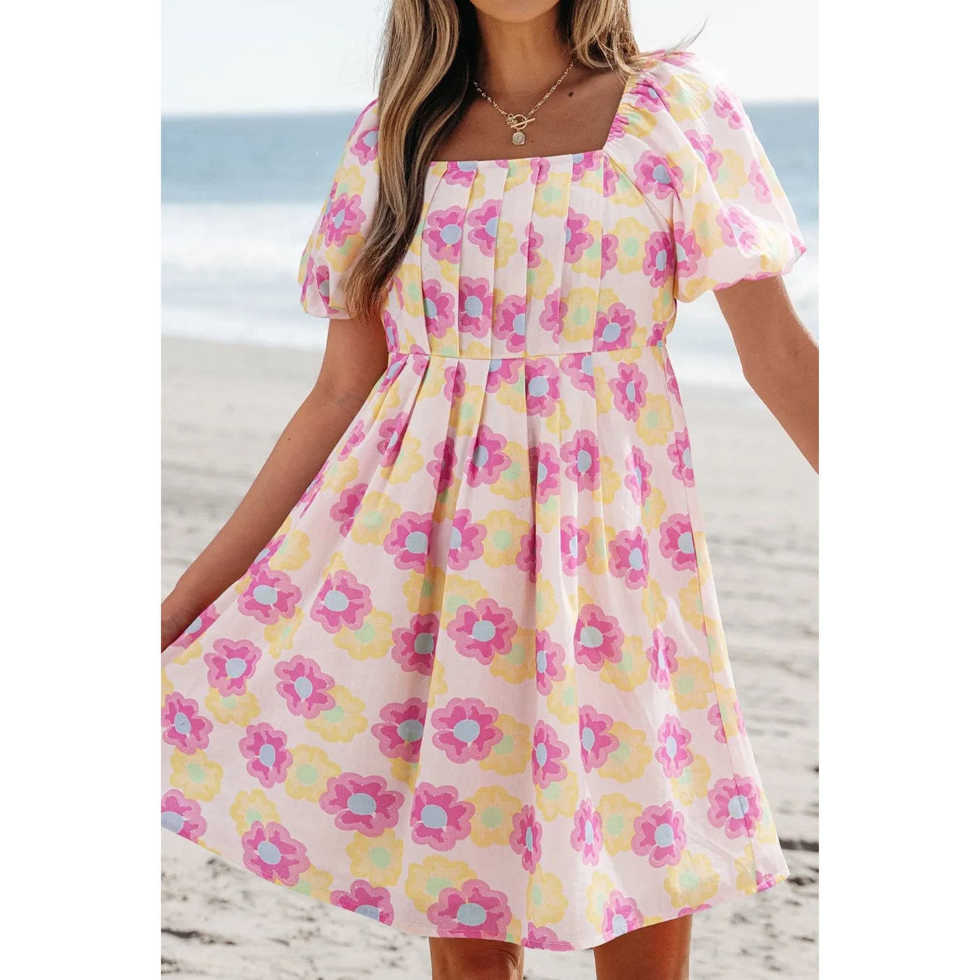 Woman wearing a Dusty Pink Floral Square Neck Puff Sleeve Pleated Flared Midi Dress.