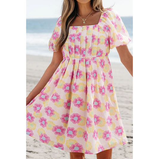 Woman wearing a Dusty Pink Floral Square Neck Puff Sleeve Pleated Flared Midi Dress.