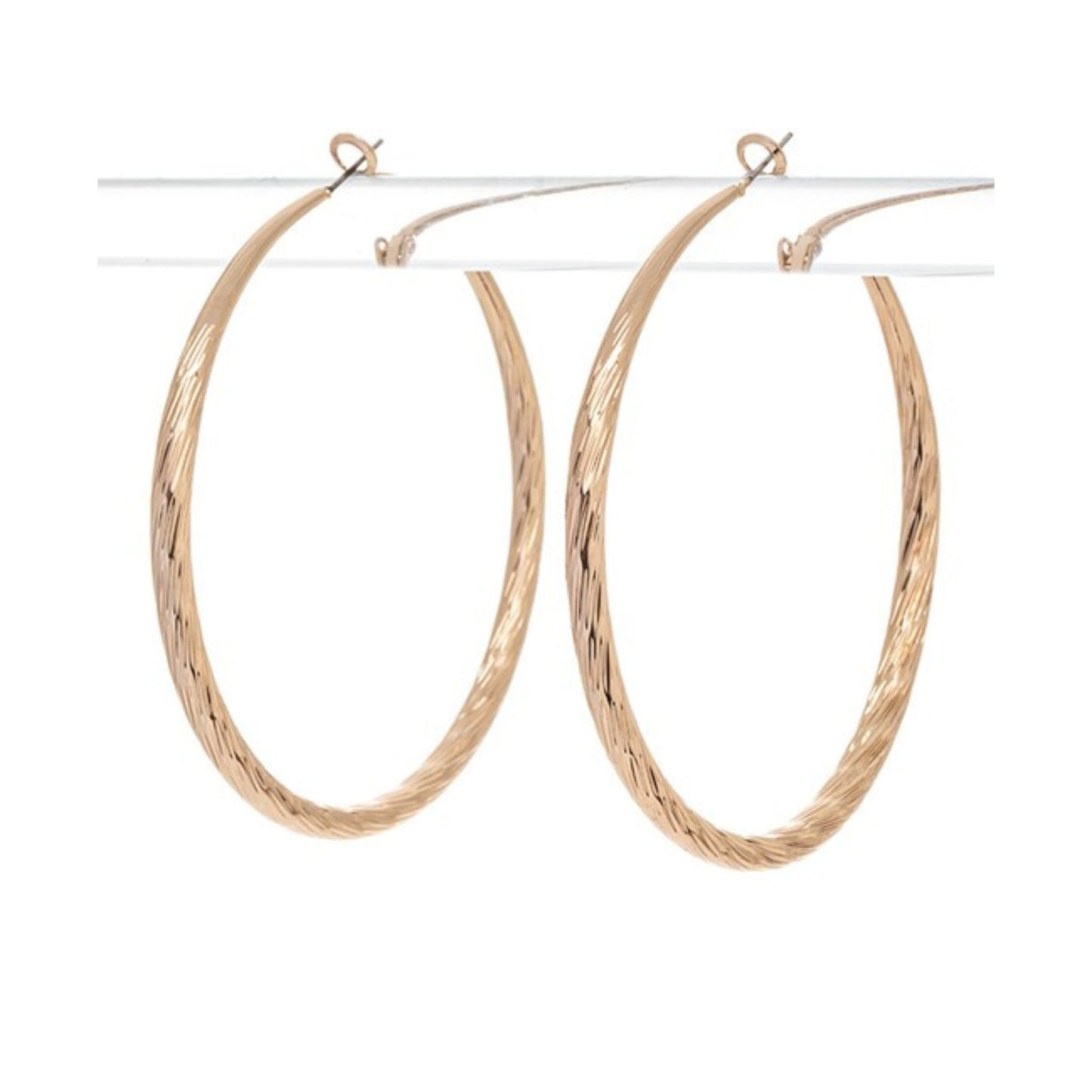 Gold hoop earrings on a white background