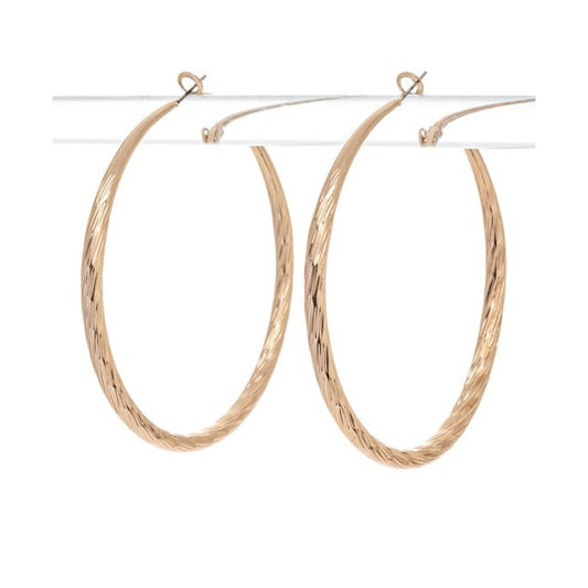 Gold hoop earrings on a white background