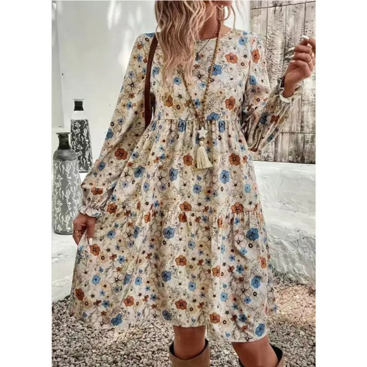 Woman wearing a floral dress with long sleeves in an outdoor setting.