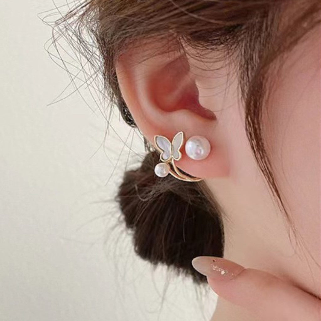 Front and Back Pearl Stud and Butterfly Ear Jacket on ear