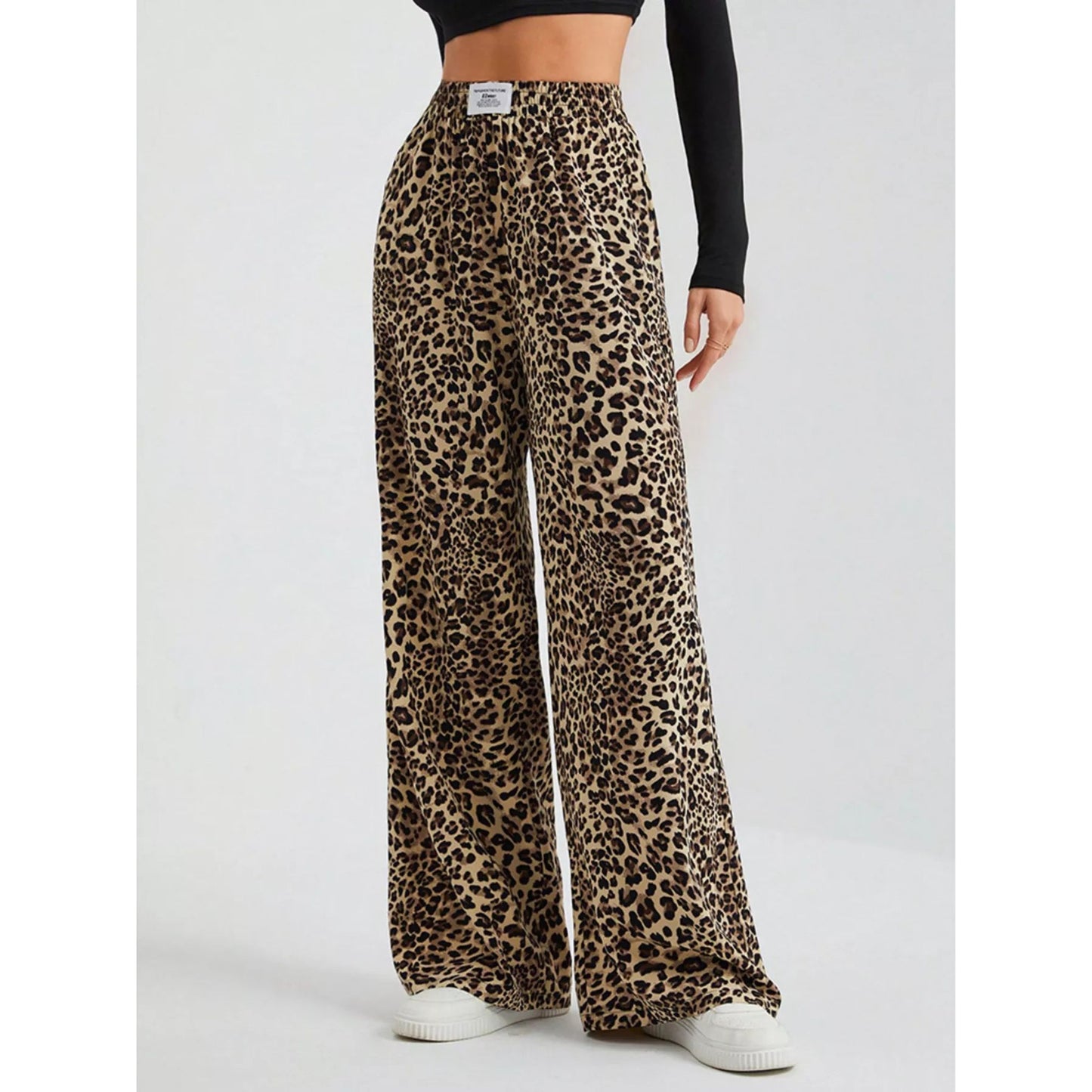 Leopard print wide-leg pants worn by a person on a white background