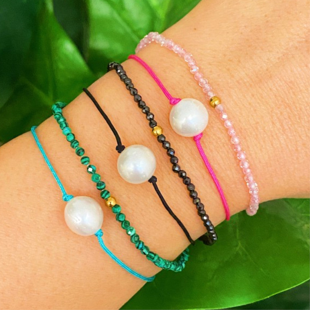 Genuine Pearl Dream Bracelet with three necklaces on wrist