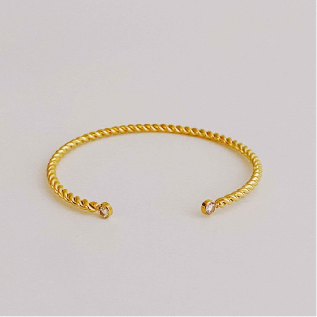 Gold Cabled Open Bangle Bracelet on white background