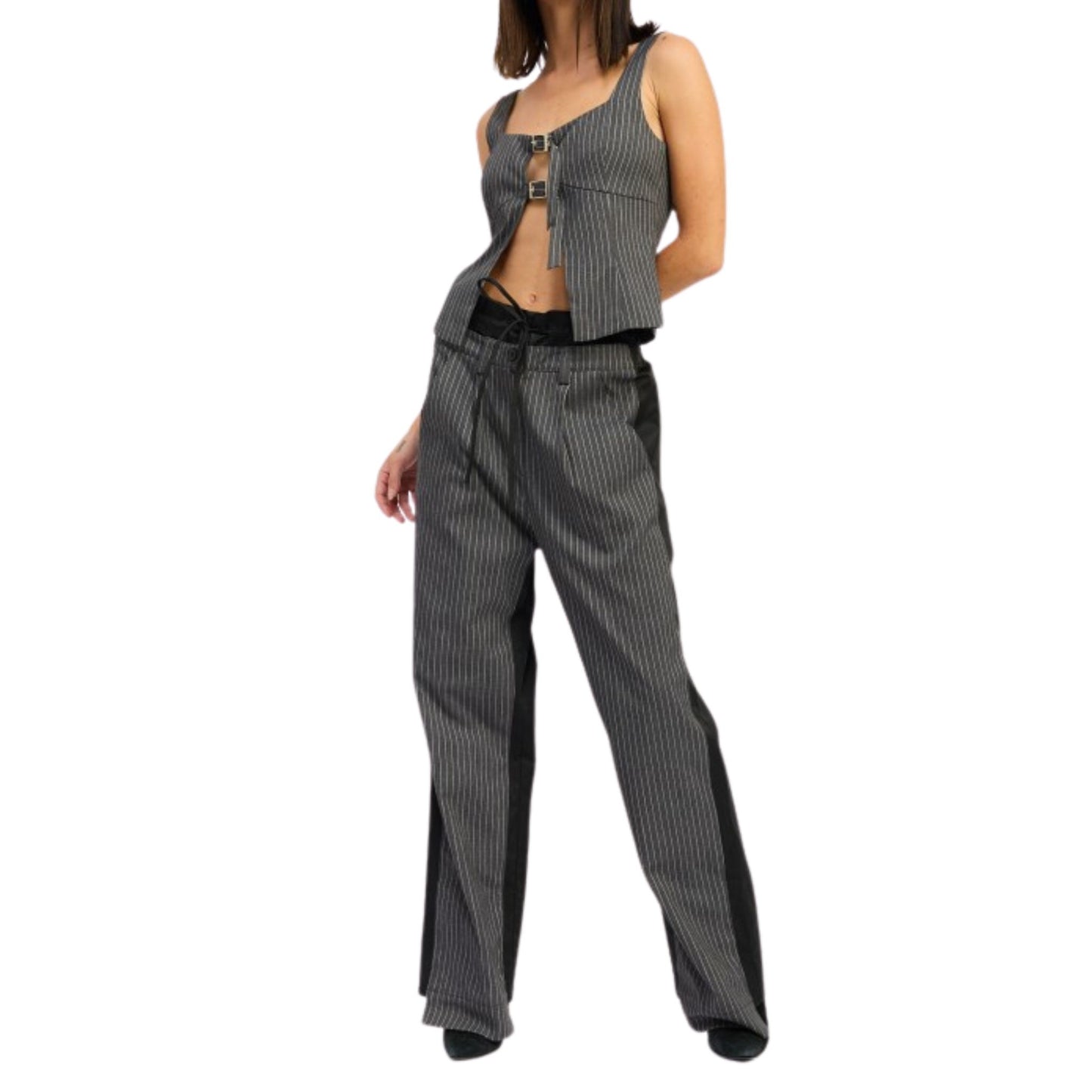 Person wearing a gray pinstripe outfit on a white background