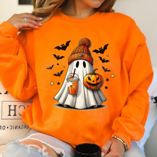 Person wearing an orange sweatshirt with a Halloween-themed ghost design.