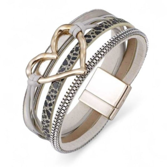 Bracelet with heart-shaped clasp and patterned band on a white background