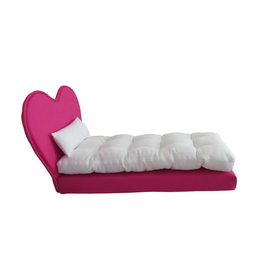 Hot pink heart-shaped bed with white mattress on a white background