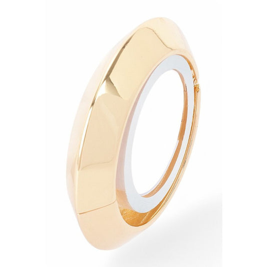 Gold ring with a white interior on a white background