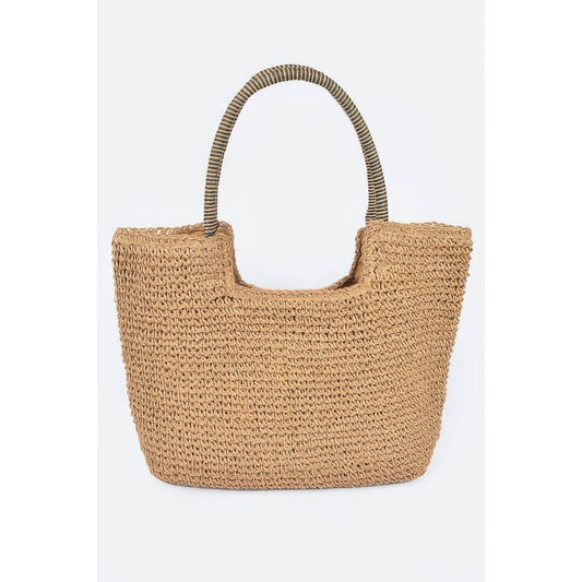 A natural woven straw tote bag with a wide top opening and two curved shoulder straps, shown against a plain light gray background.