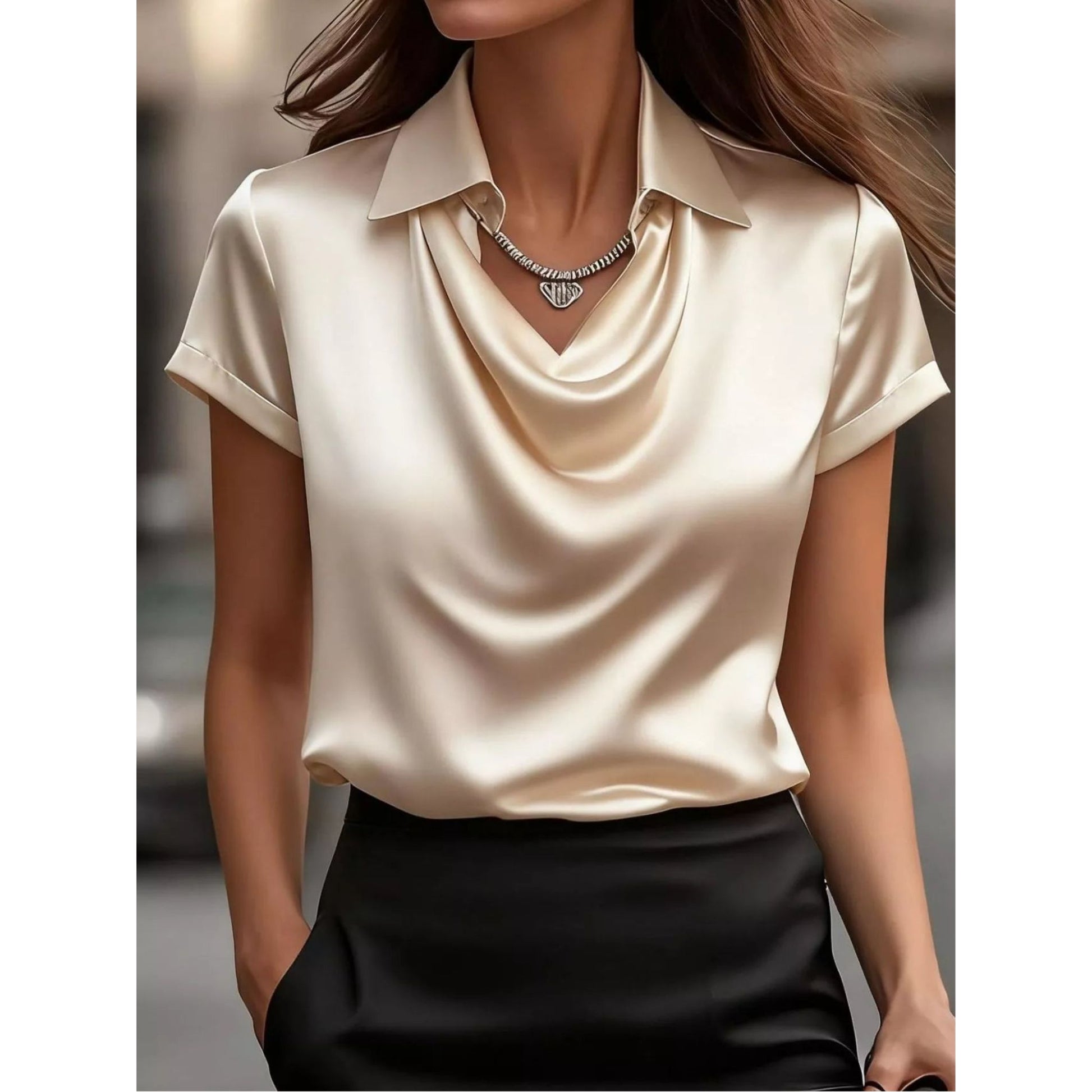 Beige short-sleeve blouse worn by a person with a blurred background
