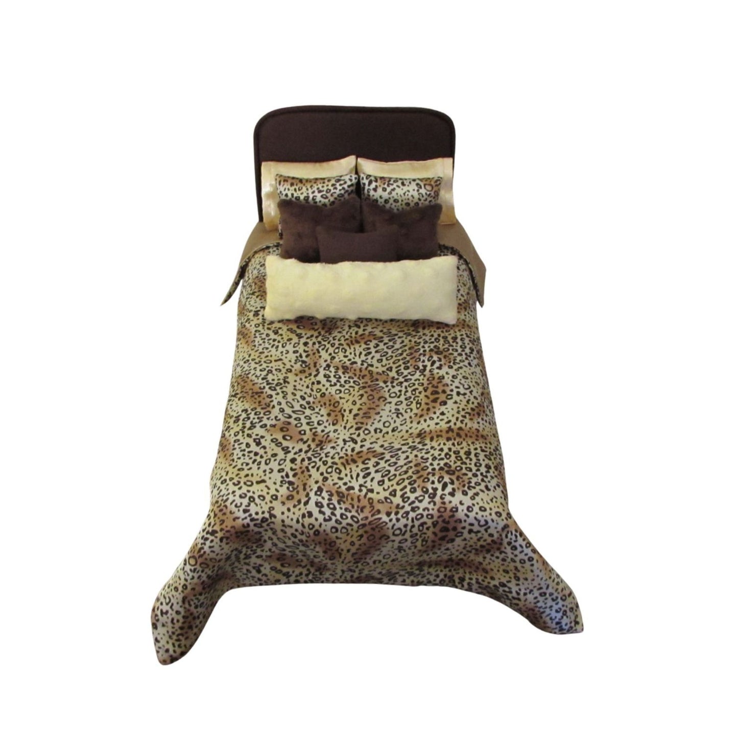 Leopard print doll bedding set with brown and light yellow pillows on a white background