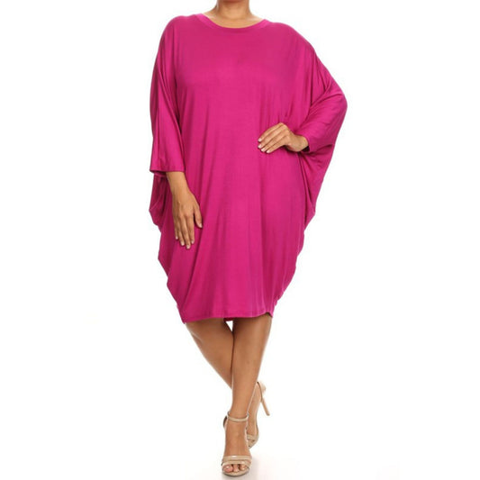 Pink dress worn by a model on a white background
