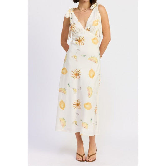 White dress with yellow floral patterns on a white background
