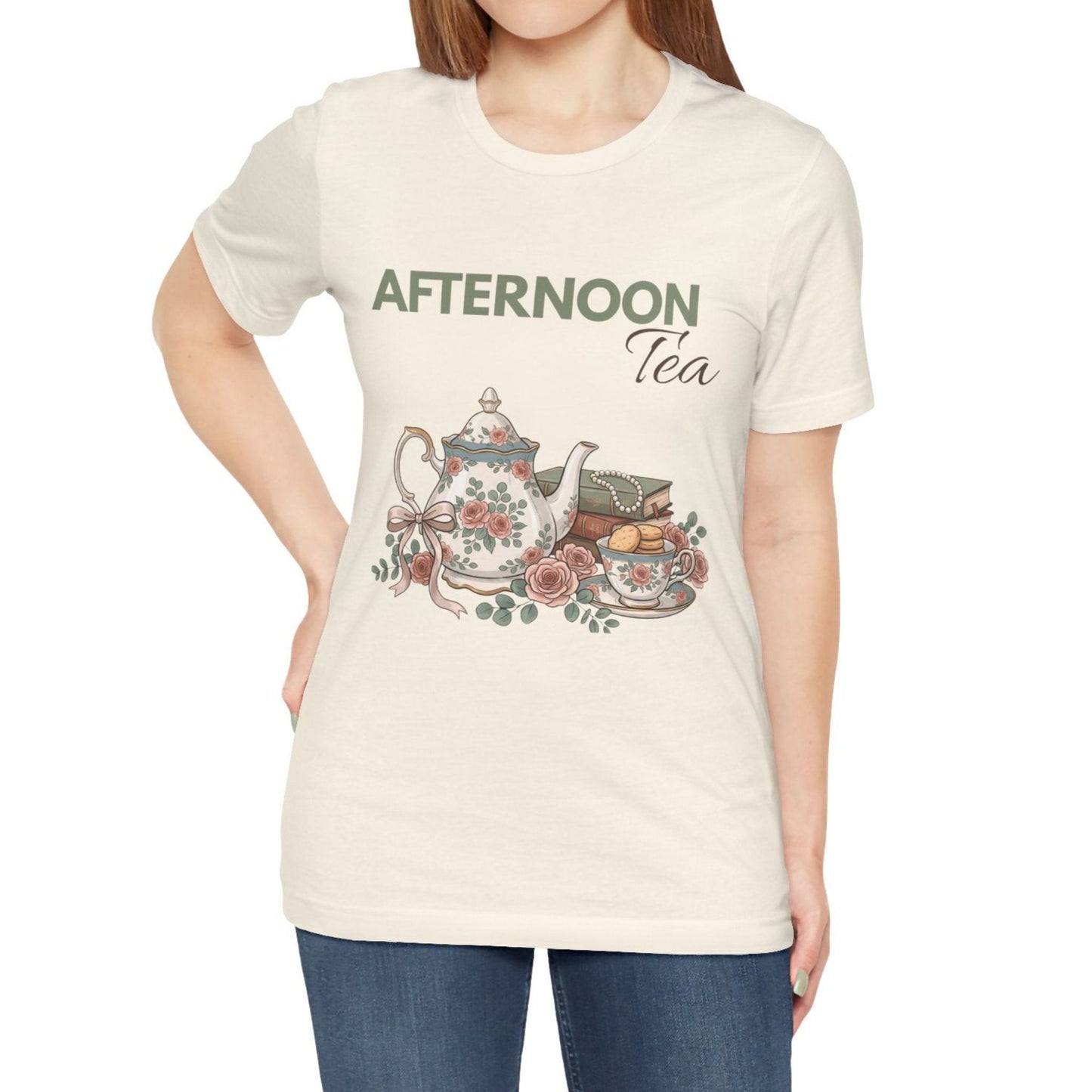 A woman wearing a natural colored t-shirt with 'AFTERNOON Tea' on the front.