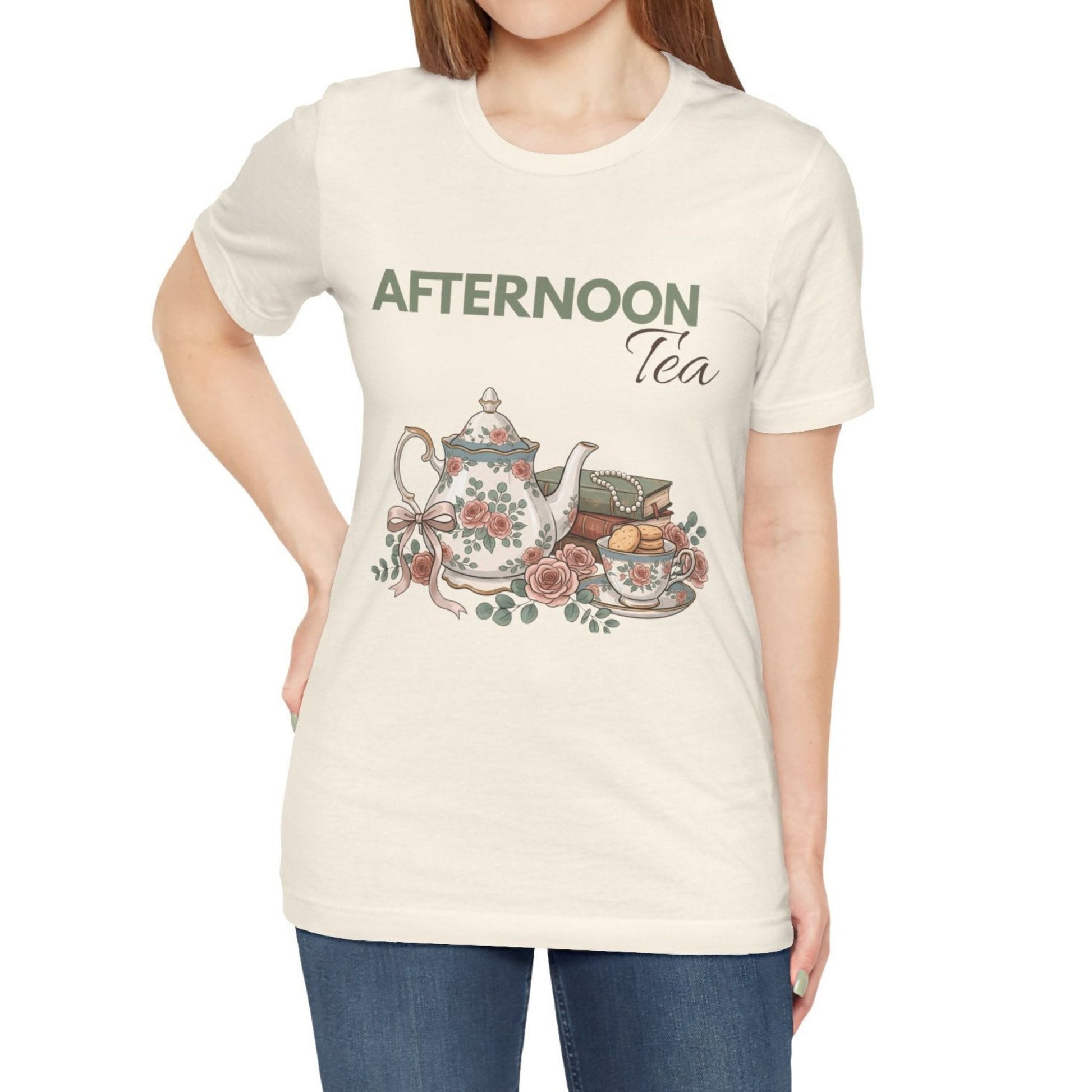 A woman wearing a natural colored t-shirt with 'AFTERNOON Tea' on the front.