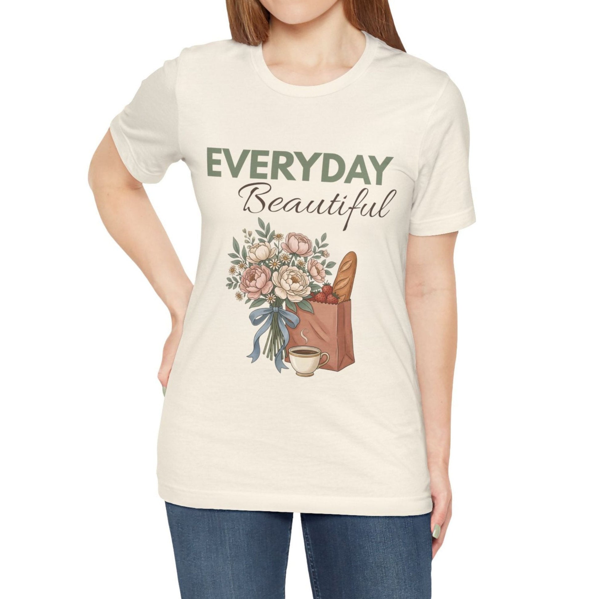 A woman wearing a natural colored t-shirt with 'EVERYDAY Beautiful' on the front.