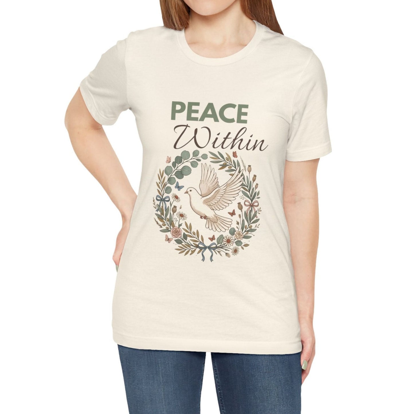 Person wearing a natural colored t-shirt with 'Peace Within' design and text.