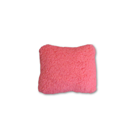 Pink textured pillow on a white background