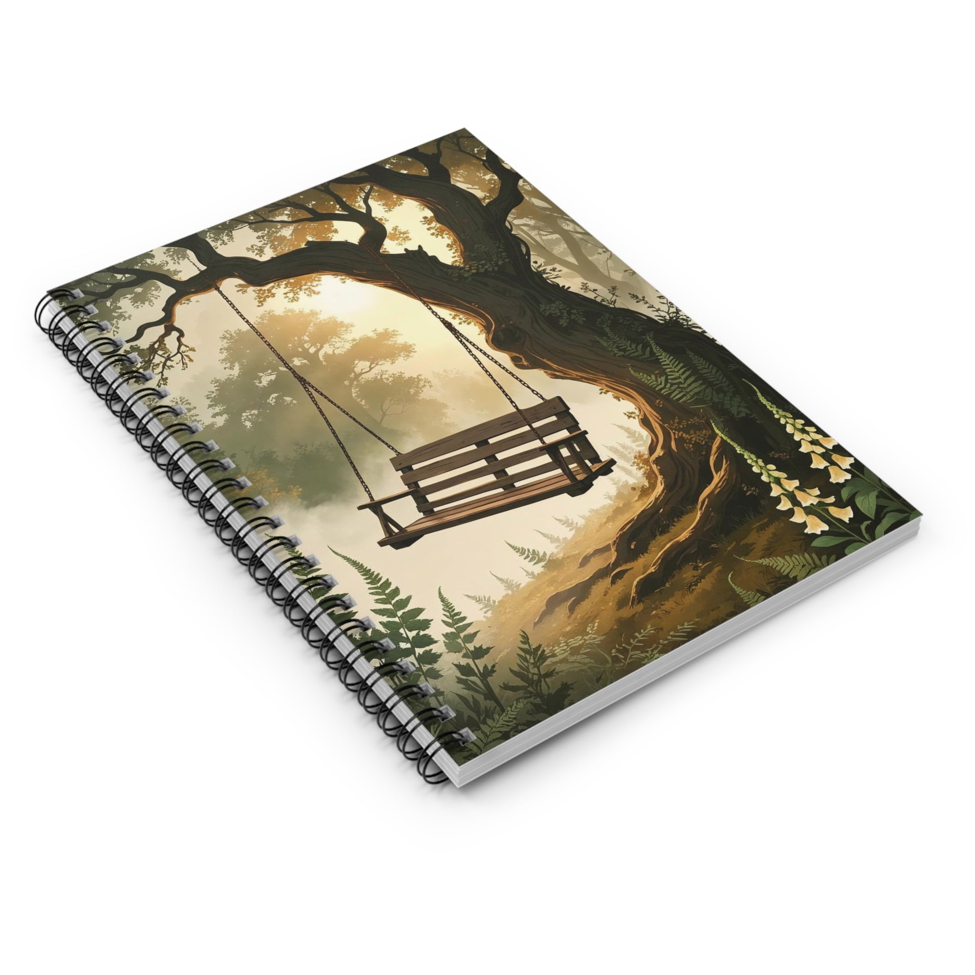 Notebook with a forest design featuring a swing hanging from a tree