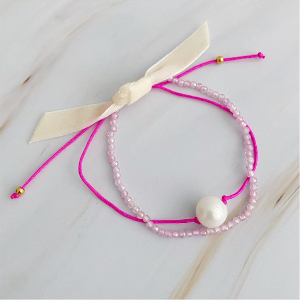 Pink Genuine Pearl Dream Bracelet on marble background and ribbon