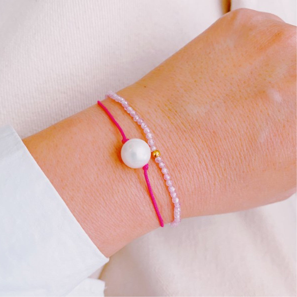 Pink Genuine Pearl Dream Bracelet on wrist with white background