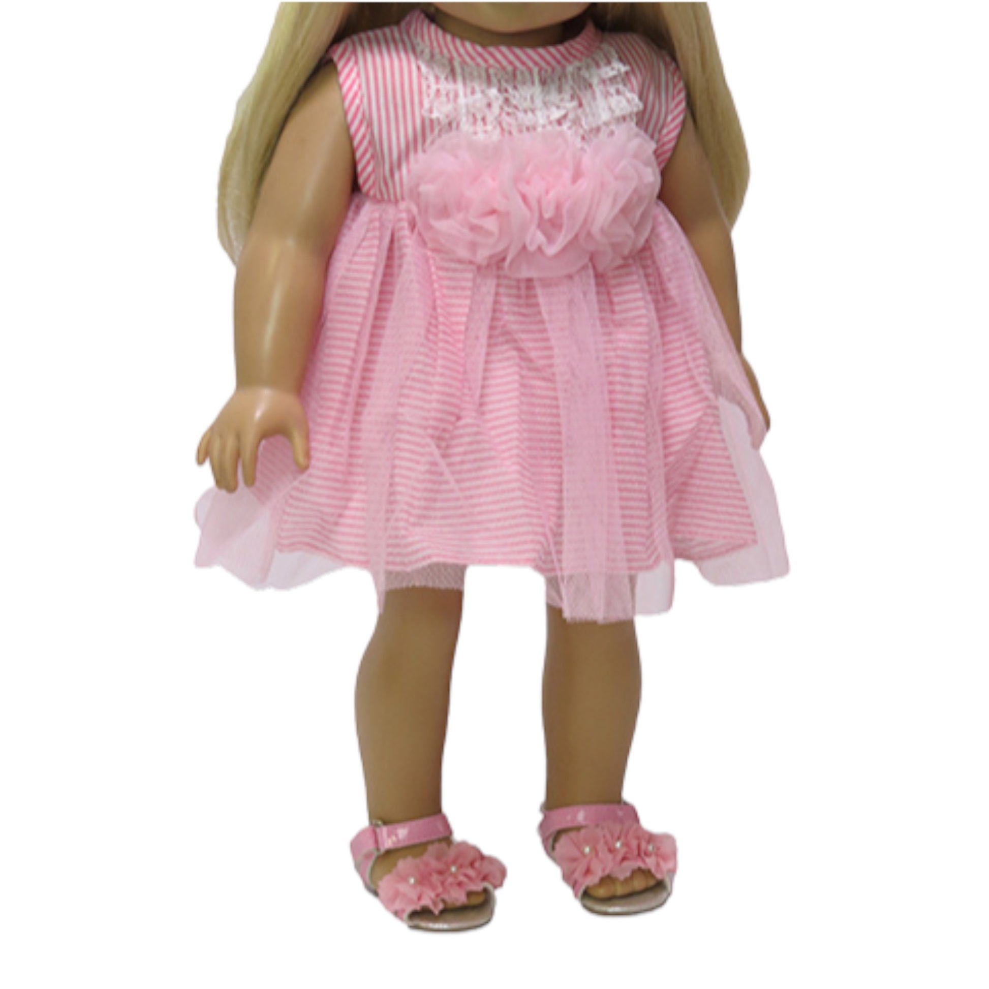Doll wearing a pink dress with ruffles and sandals on a white background