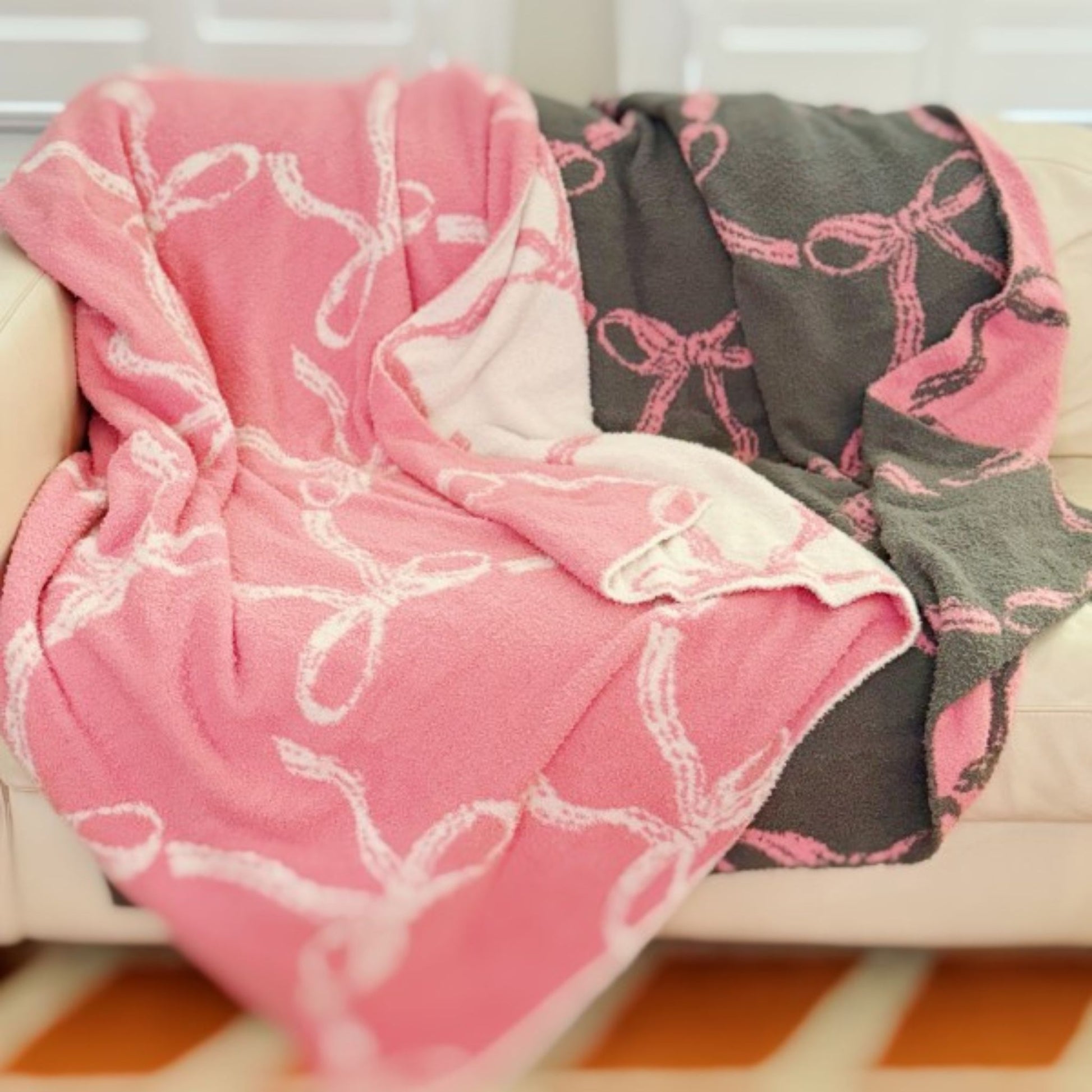 Pink and gray patterned blanket draped over a surface