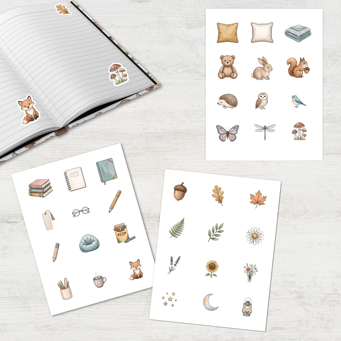 A set of watercolor-style planner stickers displayed on a light wood surface, including animal, nature, and stationery motifs such as a fox, owl, squirrel, acorn, leaves, moon, and books. An open notebook and additional sticker sheets are arranged around the products.