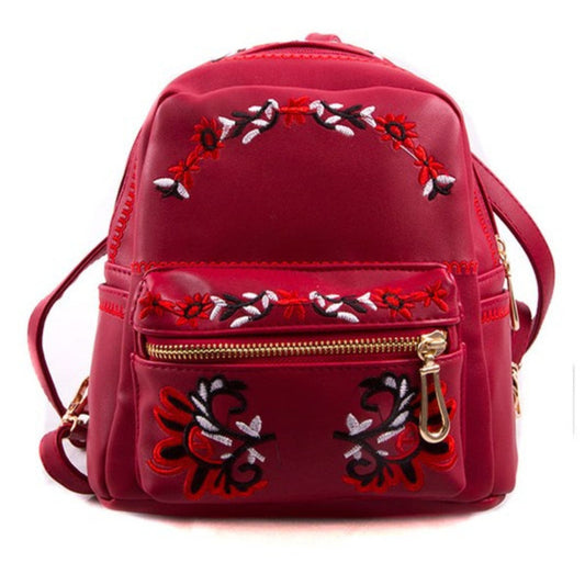 Red backpack with floral embroidery on a white background