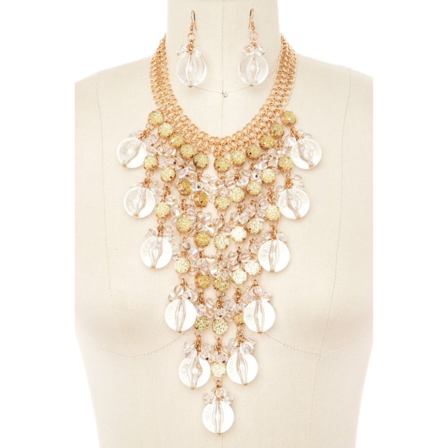 Necklace and earrings set on a mannequin with a beige background