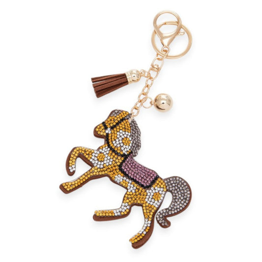 Keychain with horse design and tassel on a white background