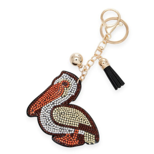 Keychain with bird design and tassel on a white background