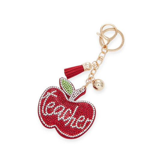 Keychain shaped like a red apple with 'Teacher' written on it, on a white background