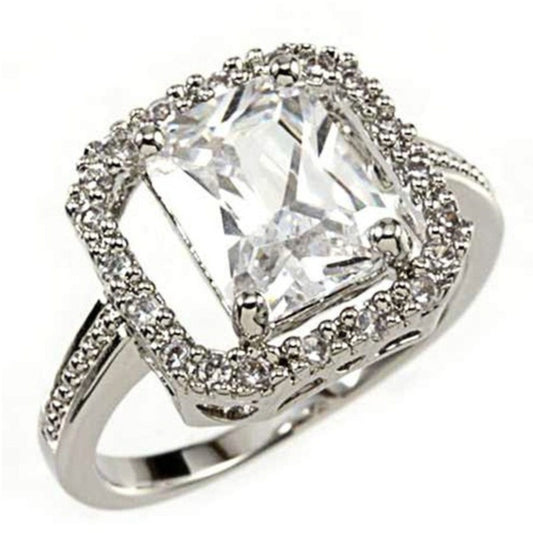 Silver ring with a large central diamond and smaller diamonds around on a white background