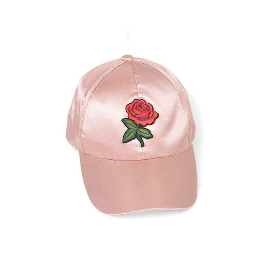 Pink cap with a red rose embroidery on a white background