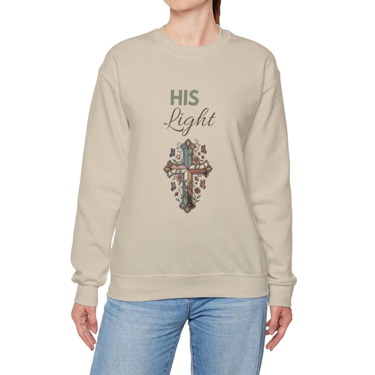 A woman is wearing a sand-colored sweatshirt with 'Hi Light' on the front.